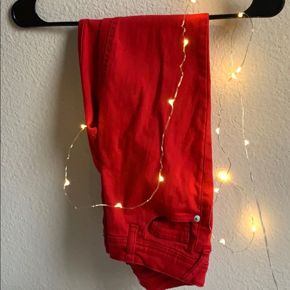 Red Skinny Jeans With Ripped Cuffs.